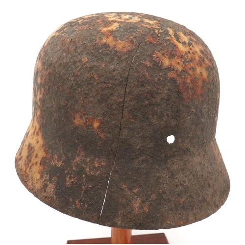 338 - German Third Reich Winter Camouflaged Wehrmacht Excavated Helmet
M1940 steel helmet with lower rolle... 