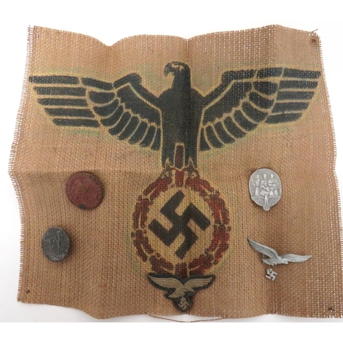 346 - Small Selection Of German Third Reich Badges
consisting embroidery Luftwaffe ski cap eagle and swast... 