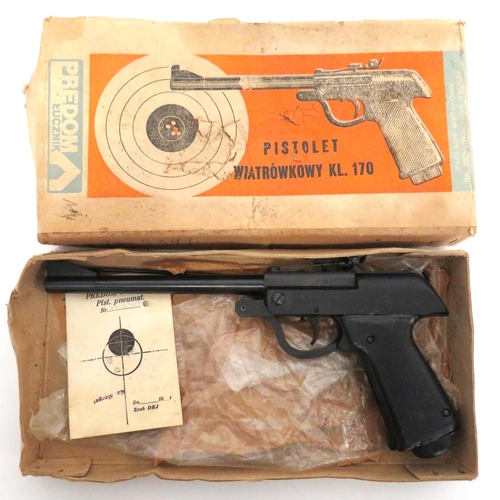 Polish Wiatrowkowy KL 170 Air Pistol
.177, 9 1/2 inch, blackened hinged barrel.  Front blade sight.  Adjustable, rear leaf sight.  Blackened body with maker's details.  Blackened steel cocking trigger guard.  Black checkered slab grips.  Complete in its card case.  