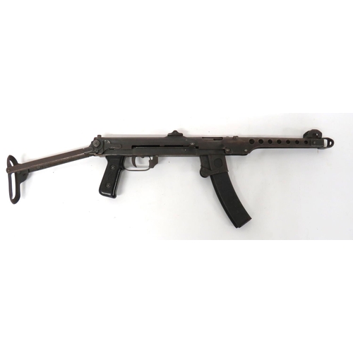 Deactivated Communist PPS Sub Machine Gun
7.62 mm, 10 inch barrel with outer pierced shroud.  Hooded front sight.  Rear flip battle sight.  Pressed steel body dated 1955.  Lower pressed steel body, trigger guard and magazine housing.  Removable curved magazine.  Black composite checkered grips.  Pressed steel folding butt.  Complete with current cert. 