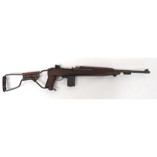 Deactivated American M1 Carbine With Airborne Pattern Stock
.30 cal, 18 inch barrel.  Front sight with protective ears.  Lower bayonet lug.  Rear breech with adjustable sight.  Side cocking bolt handle.  Steel trigger guard and magazine housing with removable magazine.  Possibly later, polished wooden half stock, top hand guard and pistol grip.  Folding steel butt with leather cheek piece.  Complete with current cert. 