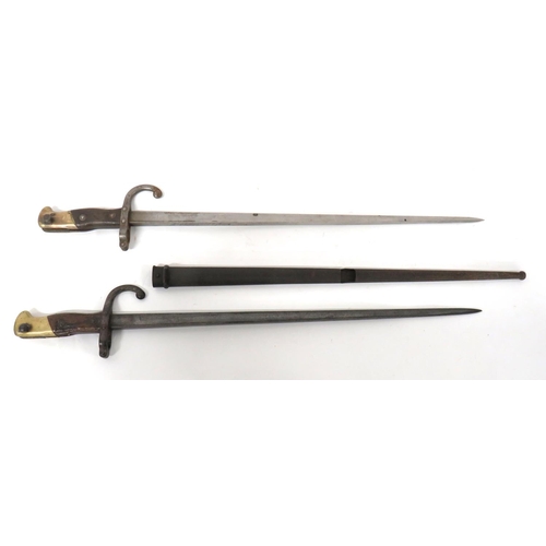 468 - Two French M1874 Gras Bayonet
consisting 20 1/2 inch, T section blade.  Back edge with maker da... 