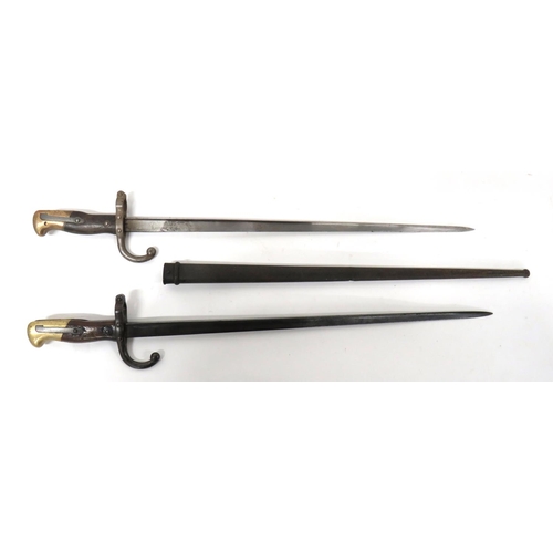 468 - Two French M1874 Gras Bayonet
consisting 20 1/2 inch, T section blade.  Back edge with maker da... 