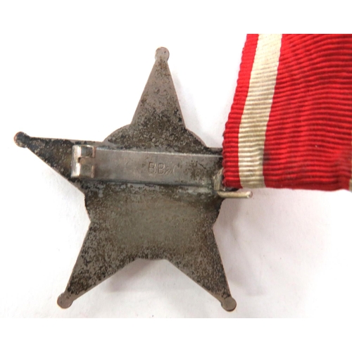 148 - Turkish Gallipoli Star
white metal, five point star with central crescent and script. Red enamel bac... 