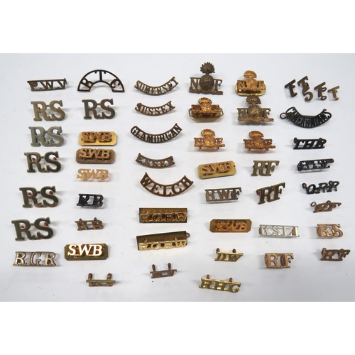 Infantry Shoulder Titles
brass include NF with grenade ... SWB ... Welch ... RB ... RGR ... RF ... DW ... RTC ... White metal RS.  50 items, some pairs.  