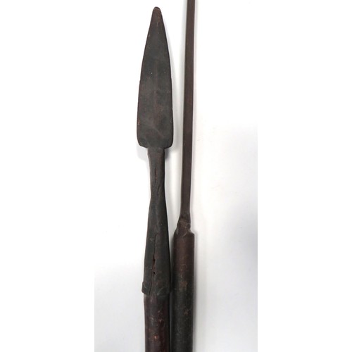 171 - Two 19th Century Spears
consisting an Indian example.  11 1/2 inch, double edged blade brazed into a... 