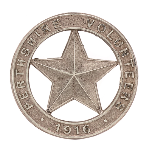 Badge. Scottish. Perthshire Volunteers 1916 WW1 VTC glengarry badge.  Good die-stamped silvered title circlet; Mullet (five pointed star) to voided centre.
    Loops East & West  VGC