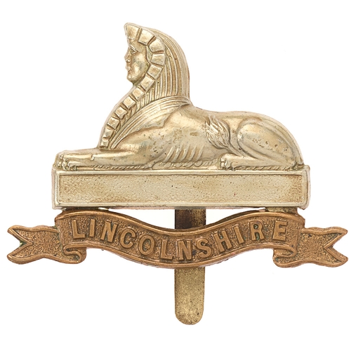 Badge. 4th & 5th Bns. Lincolnshire Regiment cap badge circa 1908-15.  Good scarce die-stamped white metal Sphinx on plain seeded tablet over brass title scroll.    Slider.  VGC  HQ's Drill Halls at Lincoln and Grimsby