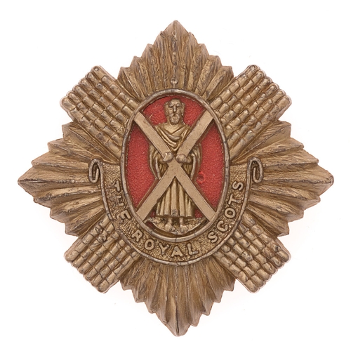 Badge. Scottish. Royal Scots WW2 plastic economy glengarry badge by Stanley & Sons.  Good scarce Thistle star with St. Andrew to centre on red insert; THE ROYAL SCOTS  scroll below.  A. Stanley & Sons, Walsall  Brass blades.  VGC