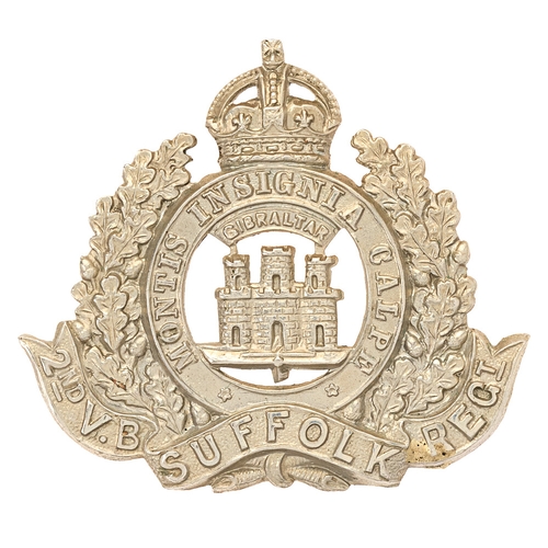 Badge. 2nd (Bury St Edmunds) VB Suffolk Regiment cap badge circa 1902-08.   Good scarce die-stamped white metal crowned MONTIS INSIGNIA CALPE circlet resting in oak sprays bearing 2ND V.B. SUFFOLK REGT. scroll; GIBRALTAR, over Castle and Key to voided centre.    Loops.  VGC  HQ at  Transferred to Territorial Force as 5th Bn., 1st April 1908