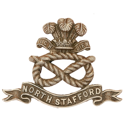 Badge. 1st VB North Staffordshire Regiment pre 1908 cap badge.  As regular battalions but all white metal.    Loops  VGC  HQ was at Stoke on Trent. Many of it’s members served in the Boer War resulting in the Battalion being awarded the honour 'South Africa 1900-02' in 1905.