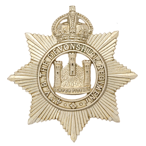 Badge. 4th (Barnstaple) VB Devonshire Regiment cap badge circa 1901-08.  Good scarce die-stamped white metal crowned 4TH VB THE DEVONSHIRE REGIMENT circlet superimposed on star; Exeter Castle to voided centre.,    Loops  VGC