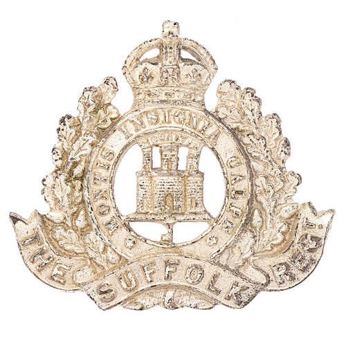 Badge. Suffolk Regiment Officer's cap badge circa 1902-52.   Fine scarce die-cast silver plated crowned MONTIS INSIGNIA CALPE circlet resting in oak sprays bearing THE SUFFOLK REGT. scroll; GIBRALTAR, over Castle and Key to voided centre. Reverse impressed P.    Loops.  VGC