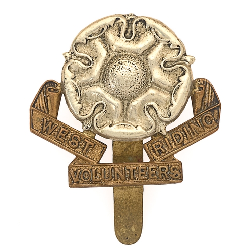 Badge. West Riding Volunteers WW1 VTC cap badge.  Good scarce die-stamped white metal Rose on brass title scroll.     Slider.  GC