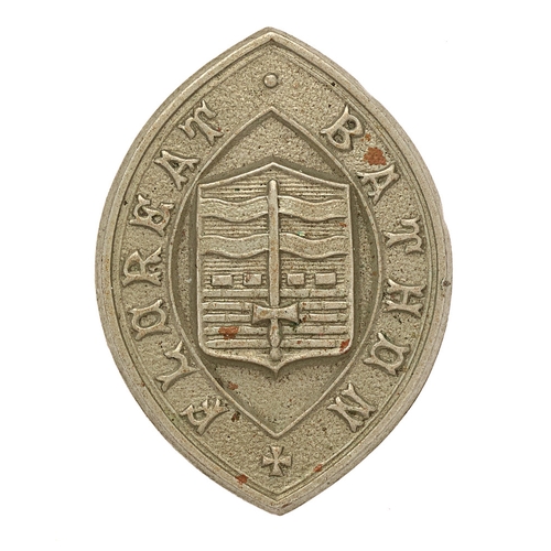 Badge. Bath School OTC cap badge. Good scarce early small die-stamped white metal vertical elliptical design inscribed FLOREAT BATHON; Arms of Bath to centre. Loops. VGC See Rawlings (2001) 157. (also worn by Bath City Police)