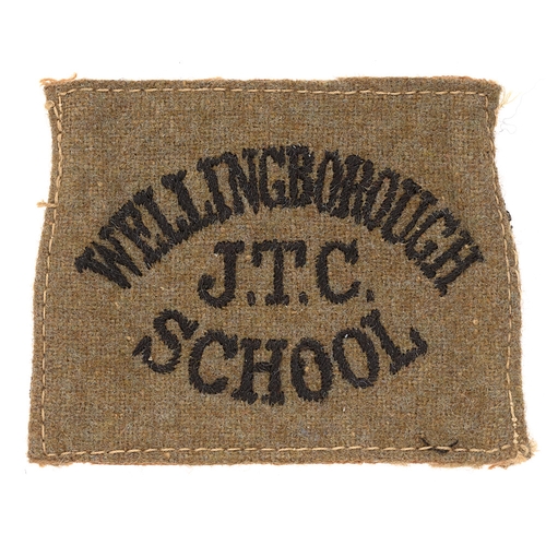 456 - Badge. WELLINGBOROUGH / JTC / SCHOOL cloth slip-on shoulder title circa 1940-48. Good scarce black e... 