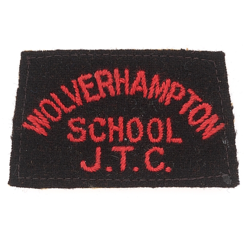 457 - Badge. WOLVERHAMPTON / SCHOOL / JTC cloth slip-on shoulder title circa 1940-48. Good scarce red embr... 