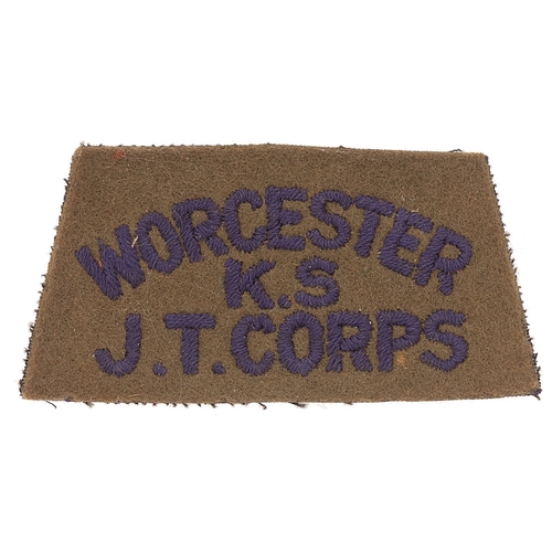 459 - Badge. WORCESTER /KS / JT CORPS cloth slip-on shoulder title circa 1940-48. Good scarce black embroi... 