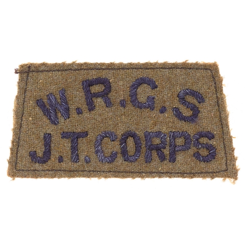 460 - Badge. W.R.G.S. / JT CORPS  cloth slip-on shoulder title circa 1940-48.  Good scarce dark blue embro... 