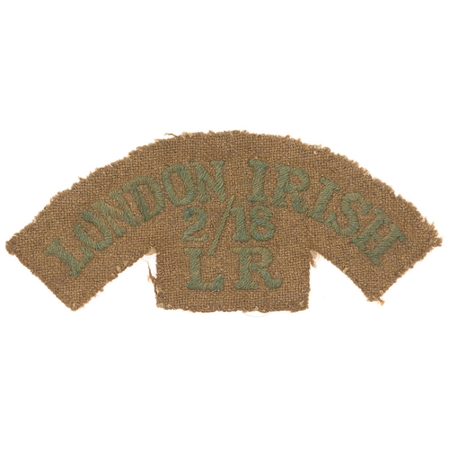 Badge. LONDON IRISH / 2/18 / LR cloth WW1 shoulder title.  Good rare green serif letters embroidered on khaki cloth.      Removed from uniform, slightly faded