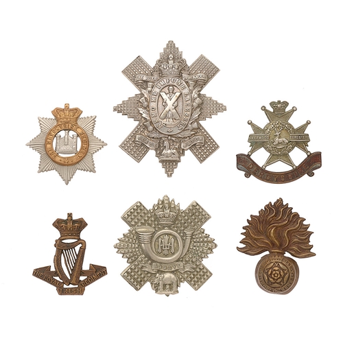 494 - Badge. 6 Victorian Infantry cap badges.  Royal Irish ... Royal Fusiliers ... Highland Light Infantry... 