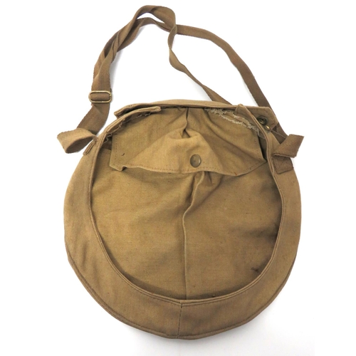 214 - WW2 Home Front Helmet Carrier Bag And Helmet
khaki canvas, rim secured carrier.  The interior w... 