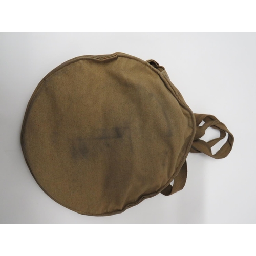 214 - WW2 Home Front Helmet Carrier Bag And Helmet
khaki canvas, rim secured carrier.  The interior w... 