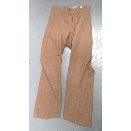 292 - Pair Of 1922 Pattern OR's Trousers
khaki woollen, high V back waist, wide leg trousers.  Hidden... 