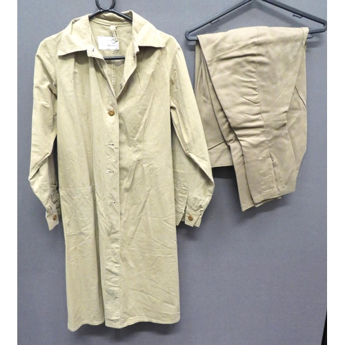 WW2 ATS Working Overall
light, khaki cotton, single part fastened front.  Right waist with open top pocket.  Rear fastened waist belt.  Issue label dated 1945.  Together with a pair of khaki, fine cord, wide leg breeches.  Slash hip, open top pockets.  Issue label "Pantaloons Cotton Cord OR".  Both items in clean condition.