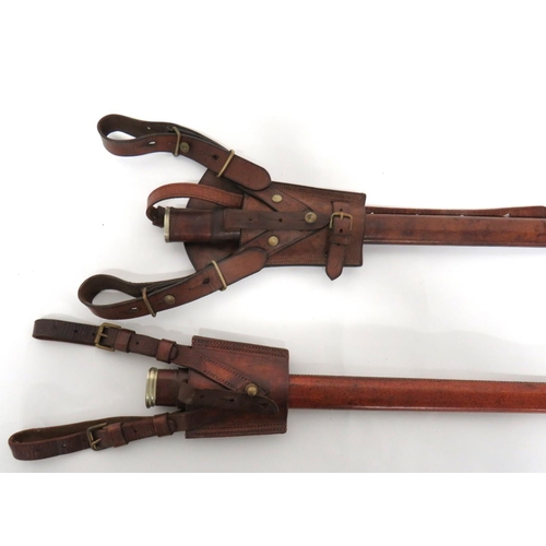 386 - Two 1897 Pattern Leather Field Scabbards
brown leather covered scabbard.  Both complete with br... 