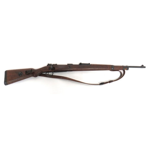 Deactivated Third Reich German K98 Rifle
7.92 mm, 23 3/4 inch, blackened barrel.  Front blade sight and rear ladder sight.  Blackened breech with maker "bcd 43".  Turn down bolt handle.  Blackened steel trigger guard and magazine floor plate.  Polished wooden full stock and top hand guard.  Blackened steel butt plate and barrel bands.  Leather rifle sling.  Complete with current cert.  