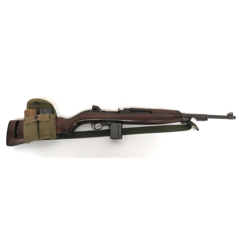 Deactivated American M1 Carbine
.31 m1 cal., 18 inch blackened barrel.  Front sight with protective ears.  Lower bayonet lug.  Rear breech with adjustable sight.  Top of barrel with maker "Inland MFG" dated 5-44.  Side cocking handle.  Blackened trigger guard and removable magazine.  Polished, half stock woodwork and top hand guard.  Steel butt plate and barrel band.  Canvas sling, oil bottle and double magazine pouch.  Complete with two spare magazines.  Complete with current cert. 