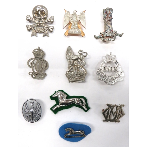 71 - 10 x Cavalry Arm Badges
consisting silvered 11th Hussars (lugs) ... White metal 17/21 Lancers (lugs)... 