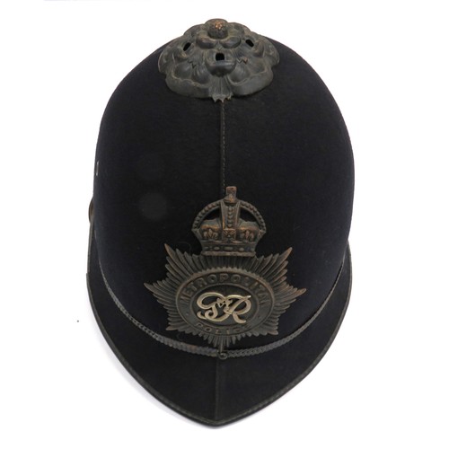 208 - Metropolitan Police Helmet And Military Cap
black, two panel crown.  Pointed peak and rounded rear b... 