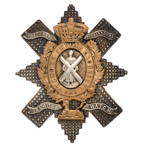 Scottish. Black Watch (Royal Highlanders) Victorian Officer's post 1881 glengarry badge.  Good scarce die-stamped silvered Thistle Star, riveted with title scrolls, mounted with gilt crowned NEMO ME IMPUNE  LACESSET oval resting in thistle sprays over Sphinx; silvered St. Andrew mounted to centre.    Loops replaced with brooch pin.  Service wear