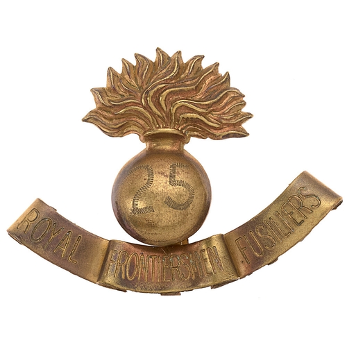 25th (Service) Bn. (Frontiersmen) Royal Fusiliers WW1 'Gamages' pattern cap badge.  Good very scarce die-stamped brass grenade, the domed ball engraved  25; attached below, a furled scroll hand engraved ROYAL FRONTIERSMEN FUSILIERS.    Slider.  VGC  Raised 12.2.1915.
