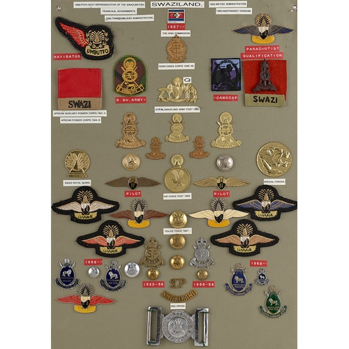 285 - Swaziland approx. 44 military and police badges etc.  Board with good display of metal and cloth bad... 