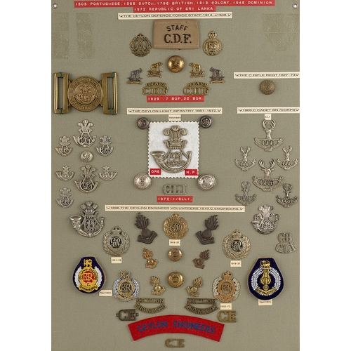 286 - Ceylon Defence Force approx. 56 badges etc.  Board with good display of metal and cloth badges, coll... 