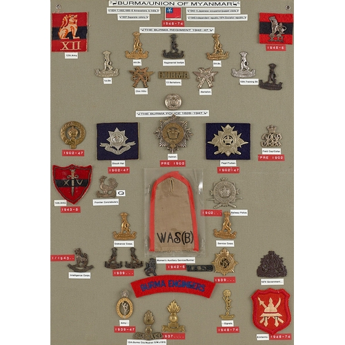 293 - Burma approx. 36 military and police badges etc.  Board with good display of metal and cloth badges,... 