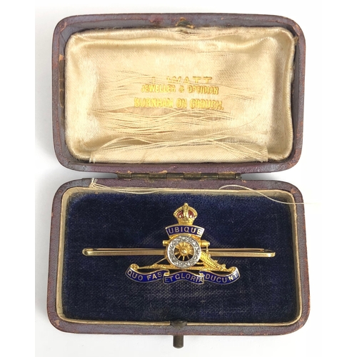 Royal Artillery 15ct Gold Regimental Sweetheart Brooch.  This Royal Artillery bar brooch, is set with small diamond chips to the wheel and with enamel decoration. Stamped 15ct to the bar and retaining pin fitting. Length 5cm,  housed in old jewellery box.