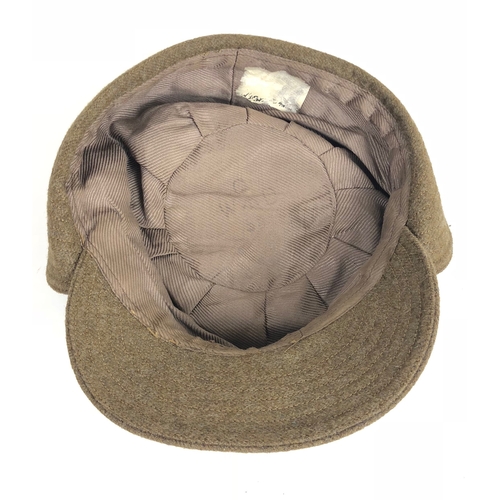 408 - WW2 1942 ATS Other Ranks Cap.  A good example of the khaki wool cap retaining cloth chinstrap and br... 