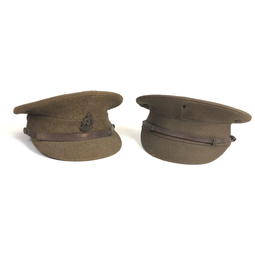 WW1 Period Officers Service Dress Cap.  A good example tailored with a thin leather chinstrap and leather buttons. The interior with cotton lining and leather sweatband. The cap retains a good shape small moth to the peak. Evidence of badge having been worn ... Accompanied by a 1922 pattern Other Rank's cap. This fitted with a WW2 plastic economy RAMC cap badge. GC (2 items)