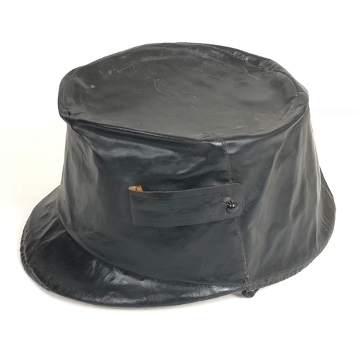 450 - Austro-Hungarian Officer's Foul Weather Shako Cover.  Good scarce example made of black oilcloth, wi... 