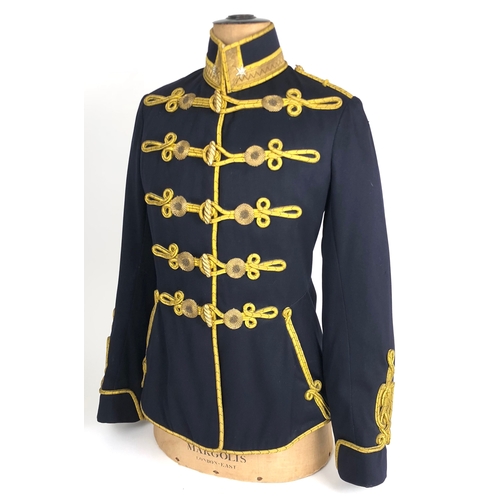 Imperial Austrian Hussar Officer's Tunic.  Good scarce example of dark blue cloth with yellow cord and bullion lines across the chest. Gold bullion lace to the collar with a single rank star. The interior with full lining. Slight age wear. GC.