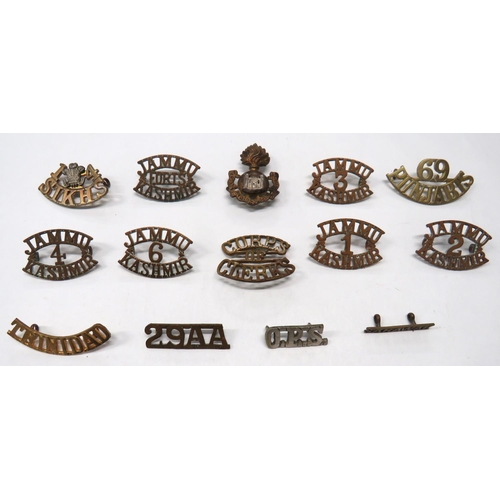 115 - 14 x Indian And Other Shoulder Titles
brass titles include 4 Jammu. Kashmir ... 1 Jammu. Kashmir ...... 