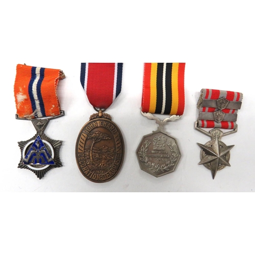 146 - 4 x Various South Africa Medals
consisting silvered and enamel Star For Merit.  Named 