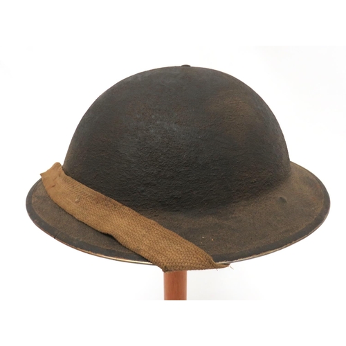 176 - WW2 Dated 1940 MKII British Steel Helmet
khaki brown, rough texture crown.  Black treated linen... 