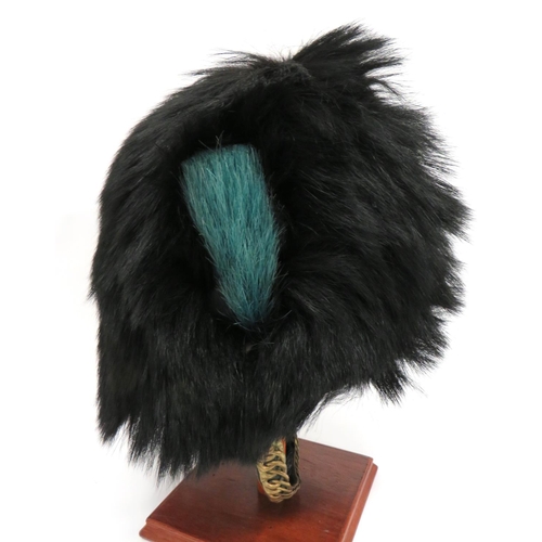 178 - Irish Guards Busby
black, long fur busby.  The right side with light blue, short horsehair plum... 