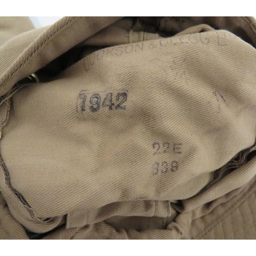 181 - Two WW2 Dated British Combat Caps
khaki cotton crown with side vents and front badge holes.  La... 