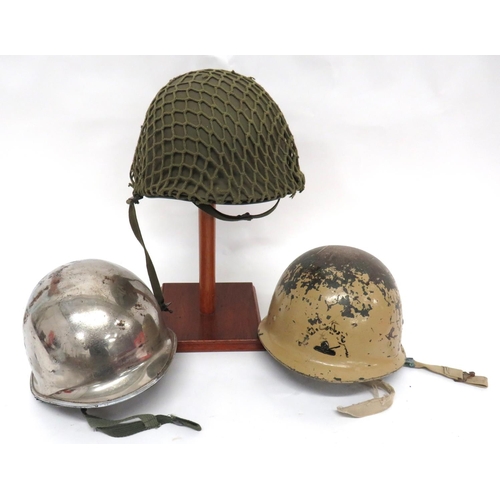 192 - 3 x Post War Helmets
consisting American pattern, green painted example.  Fibre liner complete ... 